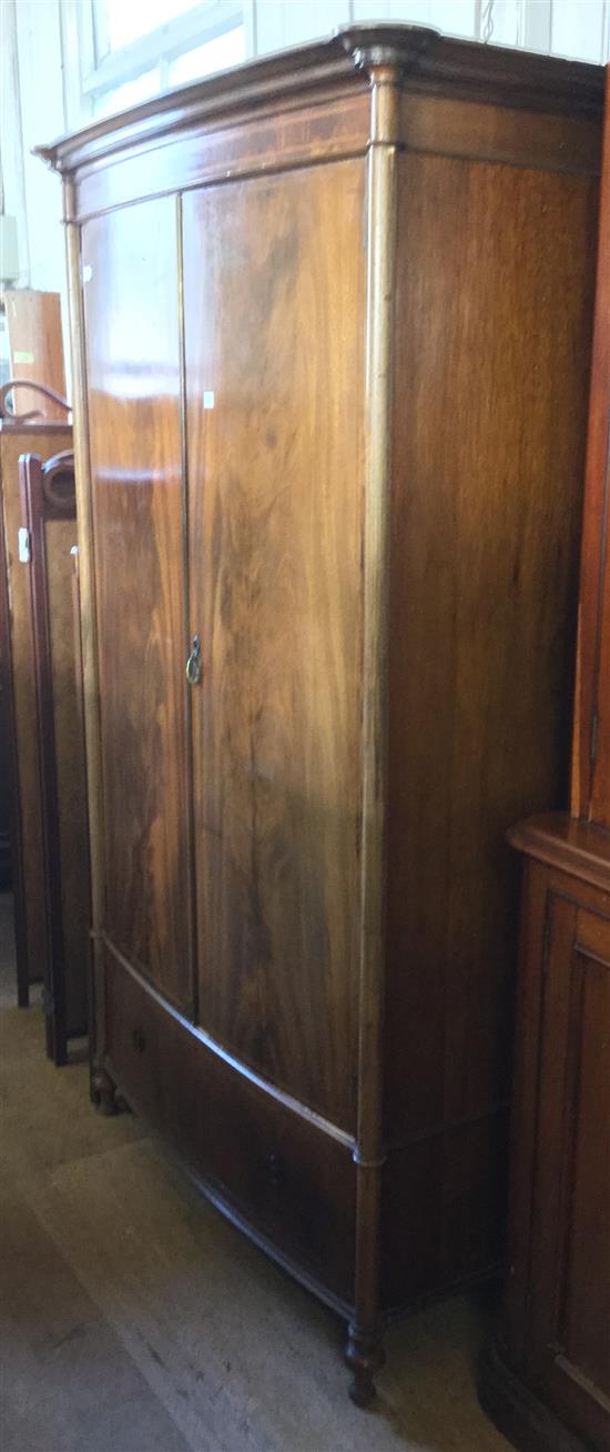 Edwardian inlaid mahogany bowfronted two door wardrobe, with internal full length mirror